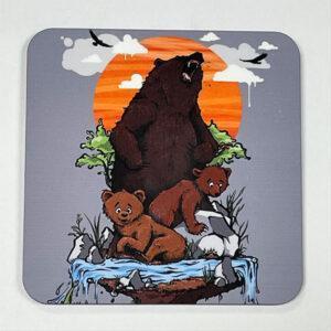 Coaster of large adult bear roaring in the background with two bear cubs in the foreground against an orange setting sun and flowing stream.
