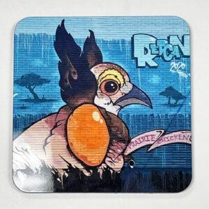 Illustrated prairie chicken head with egg against a textured blue background.